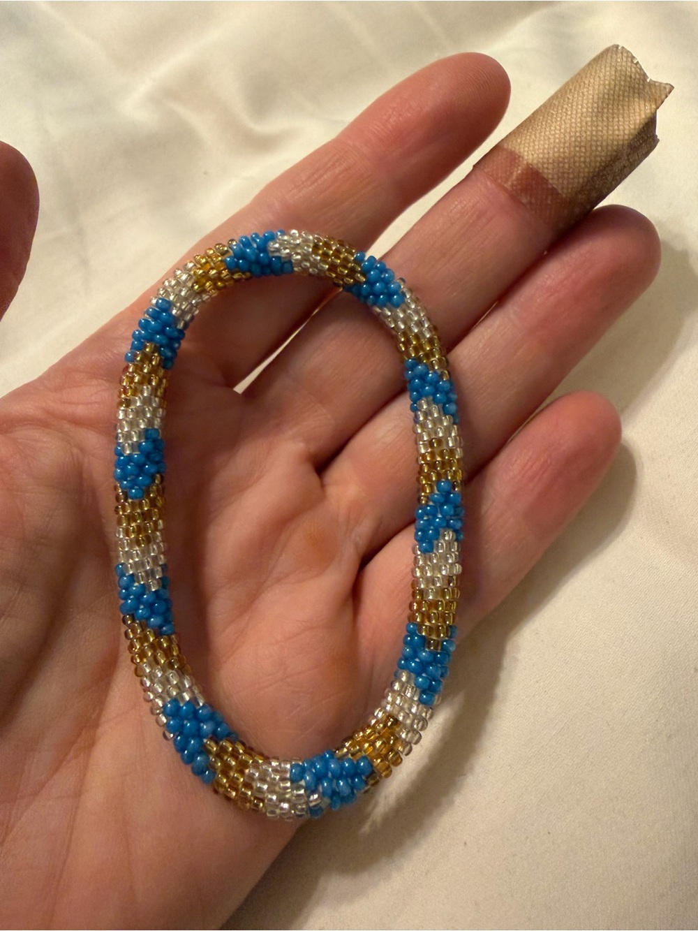 EUC Handcrafted roll on Beaded Bracelet in Blue, Gold & White.     BUNDLE